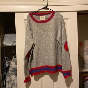 Sweater with smile on sleeve